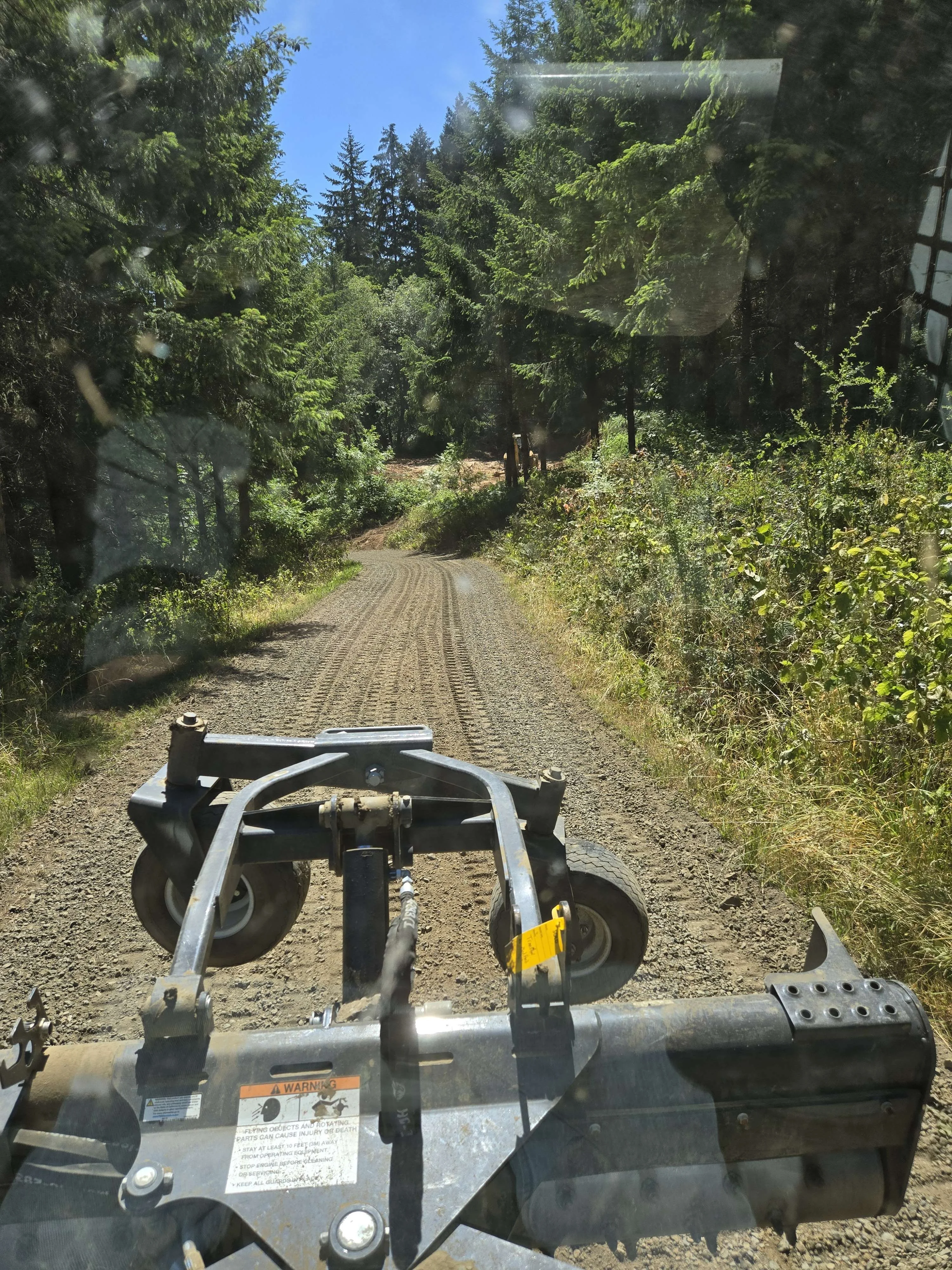After: Restored driveway with fresh gravel